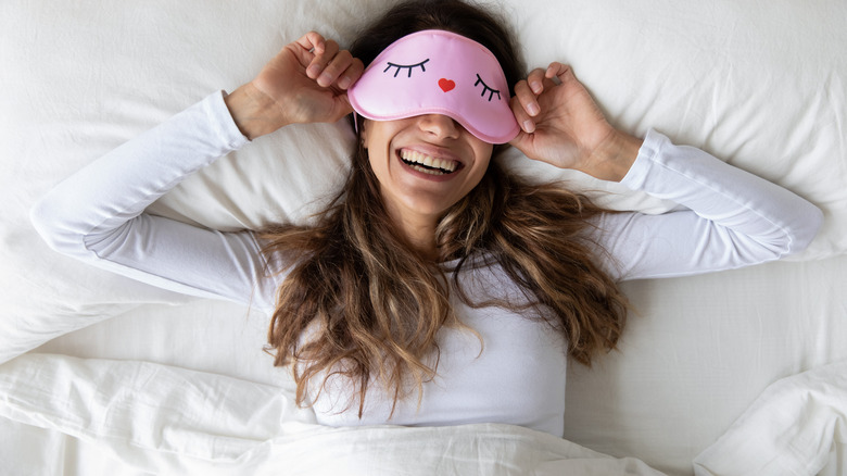 woman smiling in bed