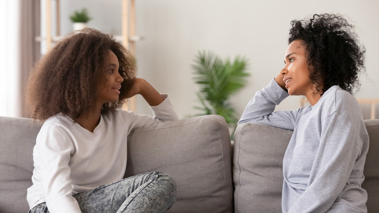 mother having conversation with daughter