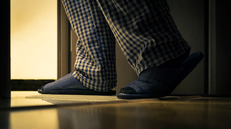 man going to toilet at night