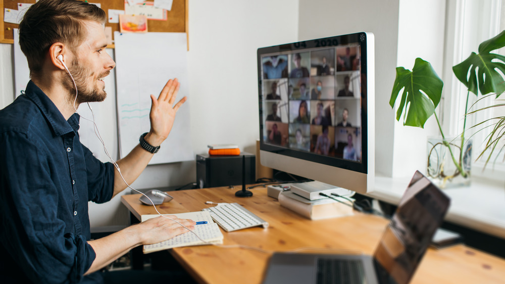 Man working remotely on video conference