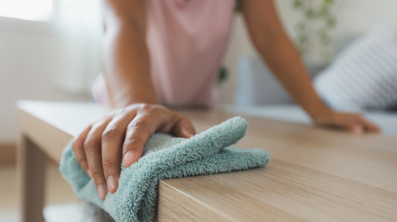 Woman cleaning her home