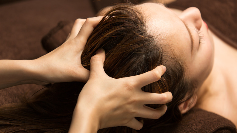 woman receiving scalp massage