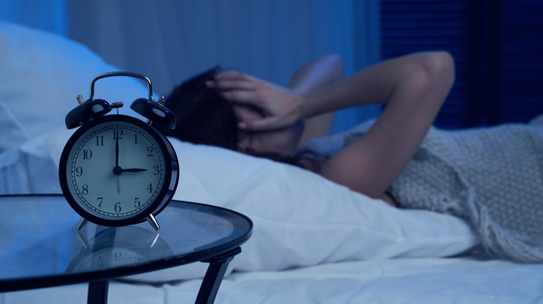 woman unable to sleep insomnia