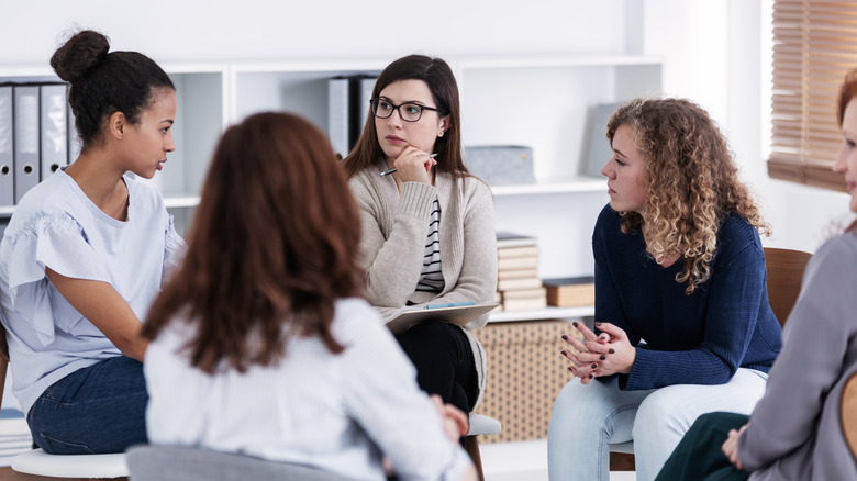 Women's therapy group of five women meet