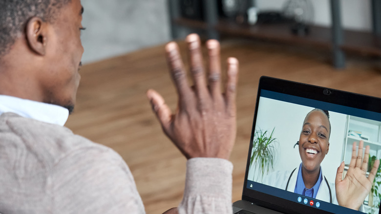 person on video call with doctor