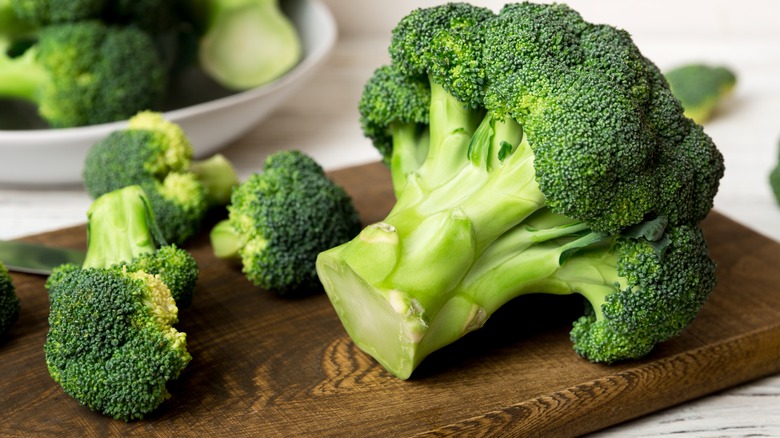 broccoli pieces on chopping board