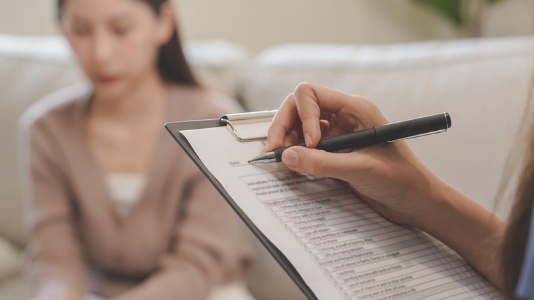 woman with psychologist getting therapy