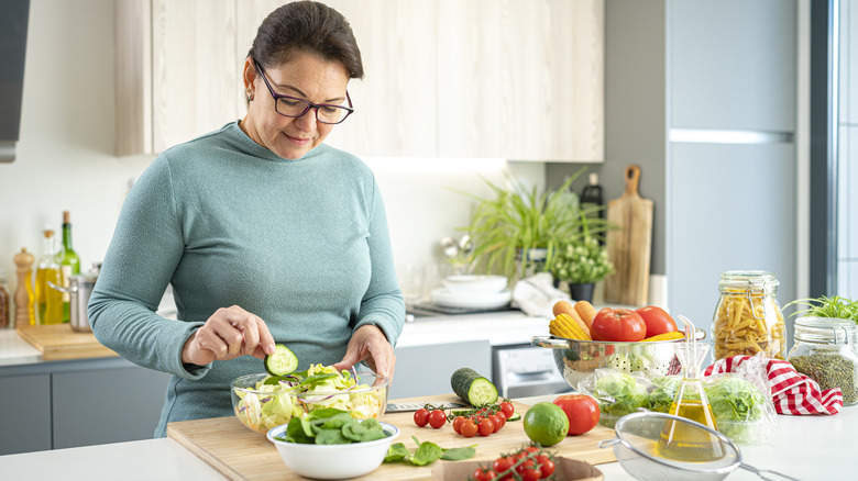 woman cooking healthy dinner at home