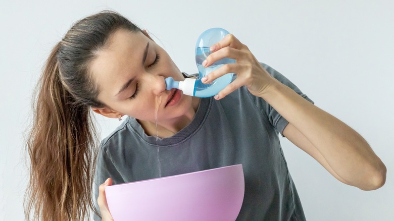 Woman using a neti pot