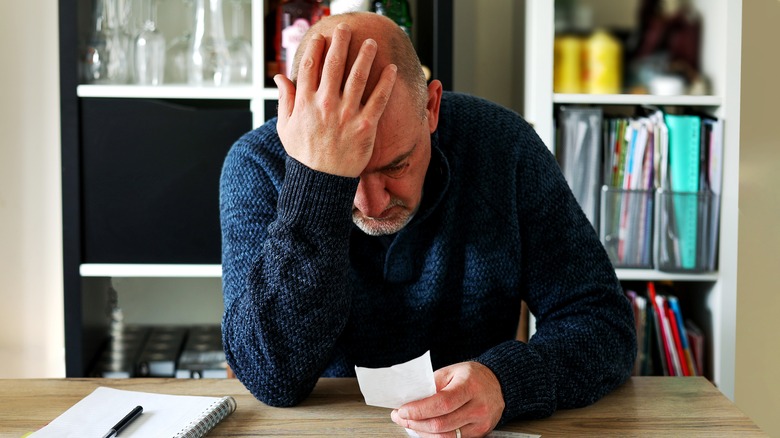 Man holding head with bad headache