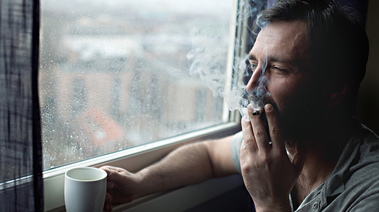 man smoking in the morning 