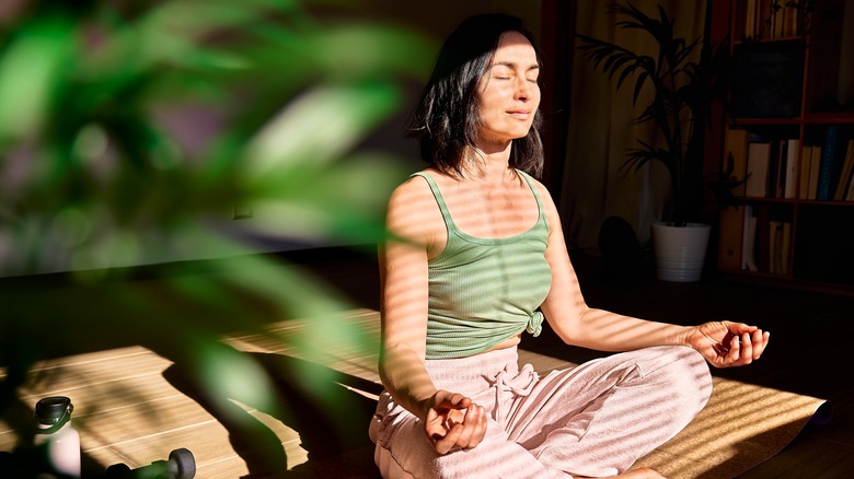 woman meditating on the floor 