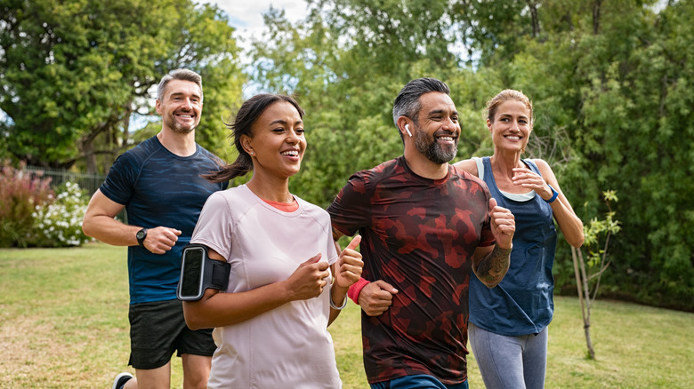 Group of people exercising outside 