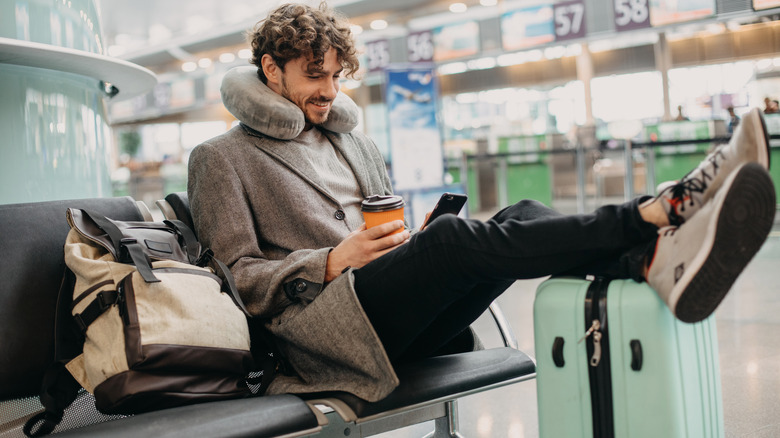 man waiting airport