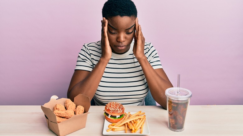 woman eating fastfood 