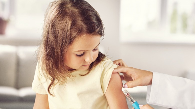 little girl getting vaccinated