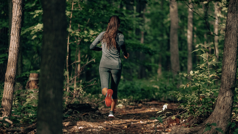 Woman running on trail