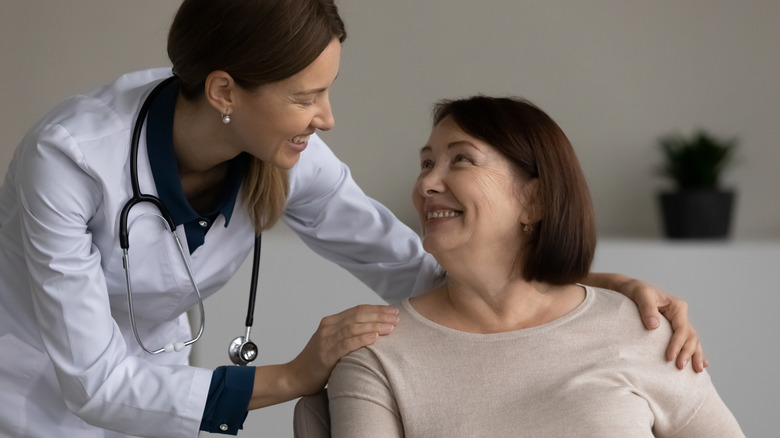 Doctor and patient smiling