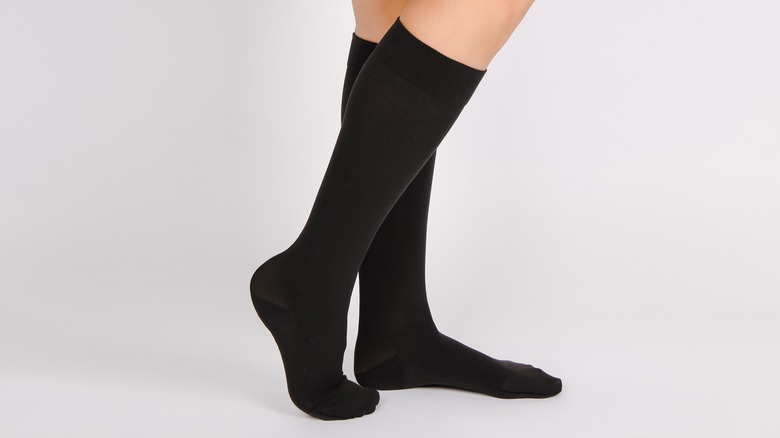 Woman wearing black socks