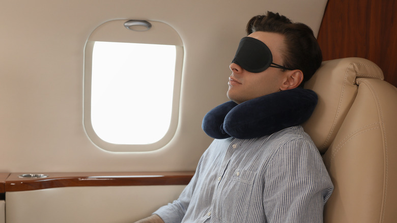 Man sleeping in airplane