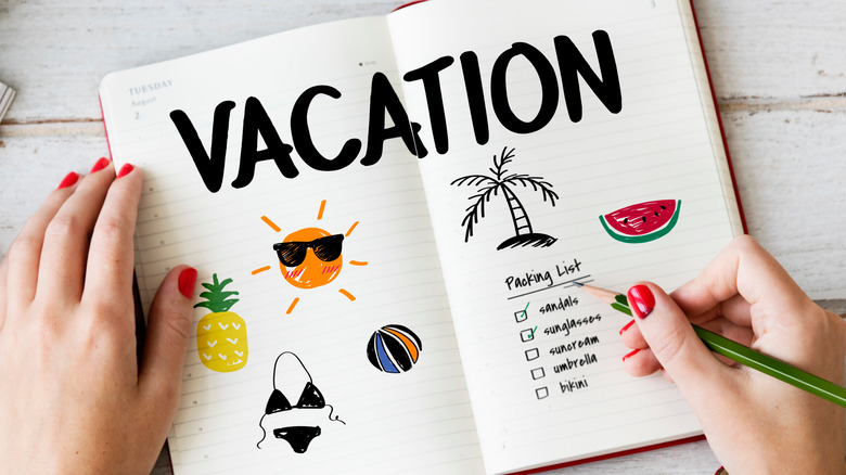 checking off items on vacation checklist