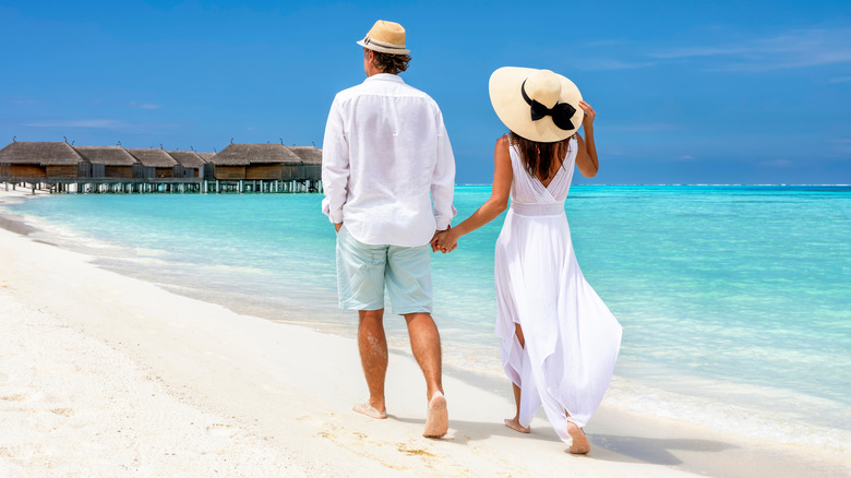 Couple walking on the beach