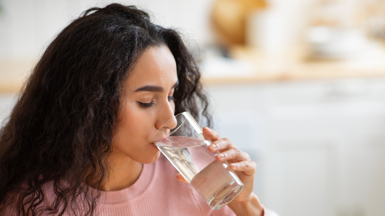 Woman drinking glass of water