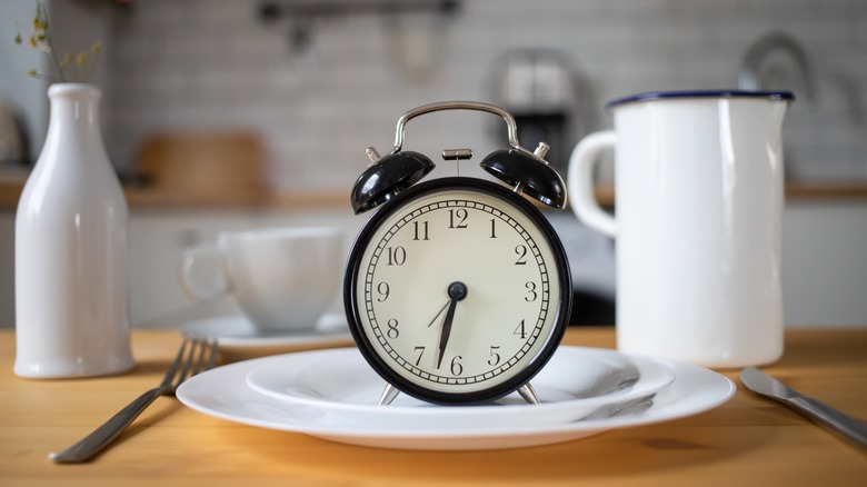 Alarm clock on a plate