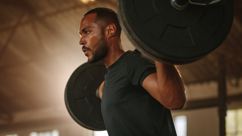 Black man doing squats