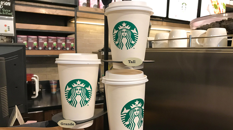 Three Starbucks coffee cups