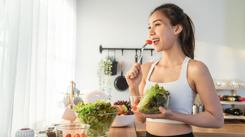 woman eating salad