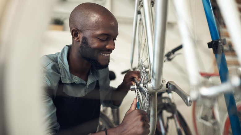 man fixing a bike 