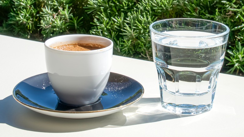 Cup of coffee and glass of water