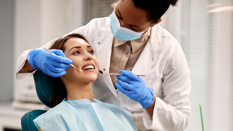 woman sitting in dentist chair