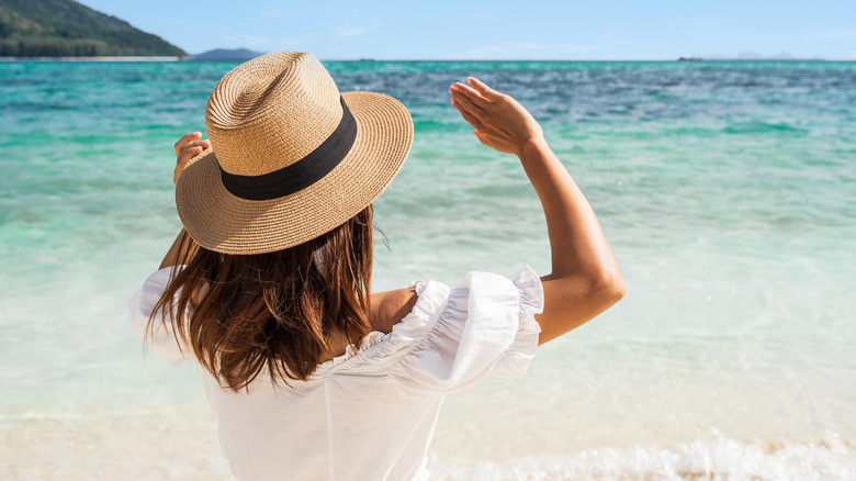 Woman shielding eyes from sun