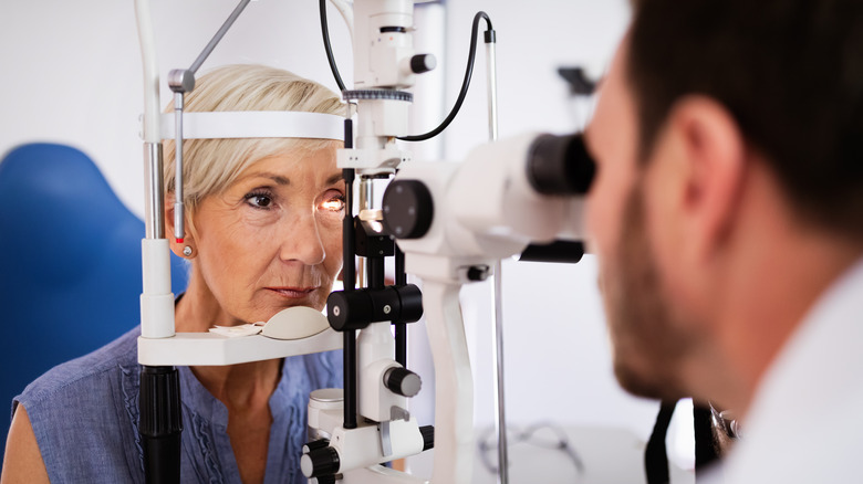 Older woman undergoing eye exam