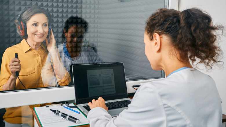 woman getting hearing checked