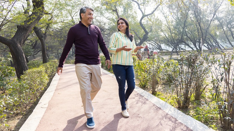 Middle-aged couple walking outdoors