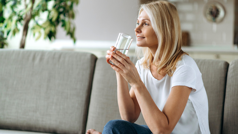 Beautiful woman drinking water 