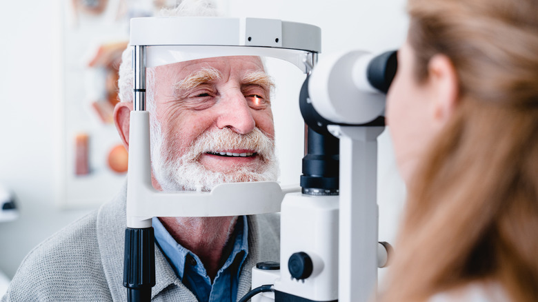 An eye doctor performs an eye exam