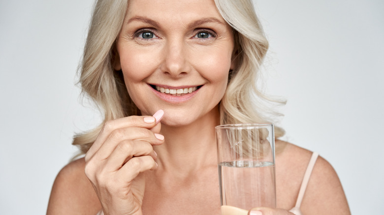 woman taking diarrhea medication