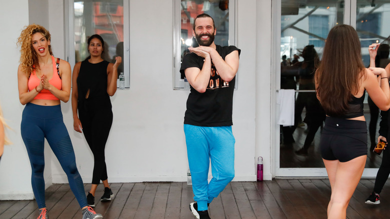 Jonathan Van Ness smiling in workout class