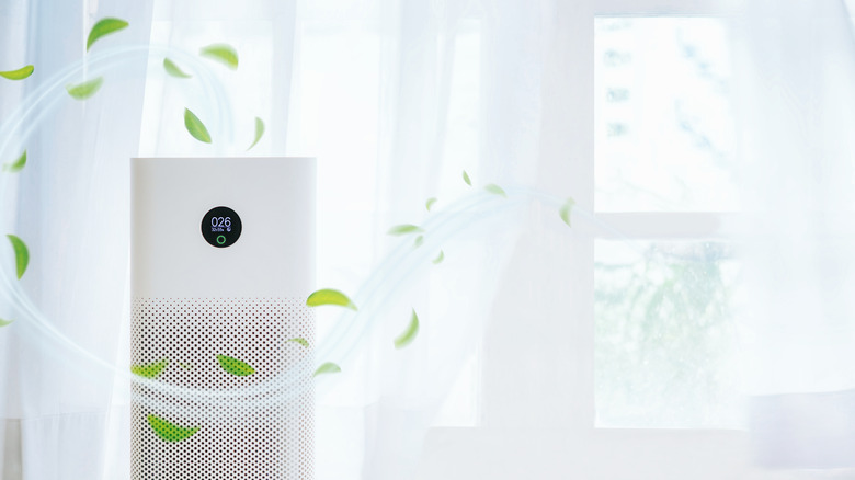 air purifier with animated leaves surrounding it 