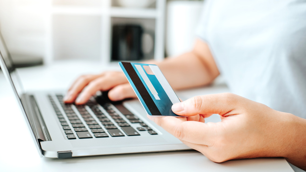 person using a computer and making a purchase