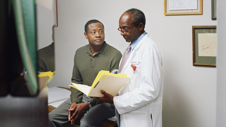 Man talking with doctor
