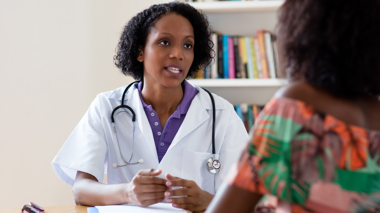 Doctor speaking with patient