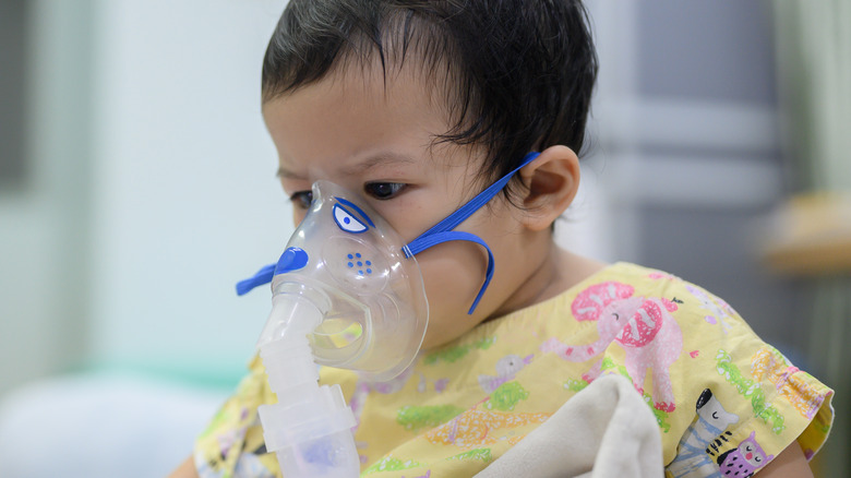 Child wearing a respirator 