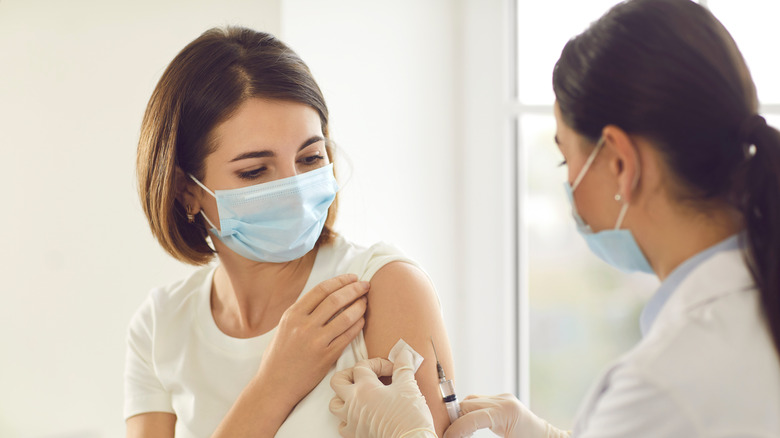 Woman getting COVID-19 vaccine