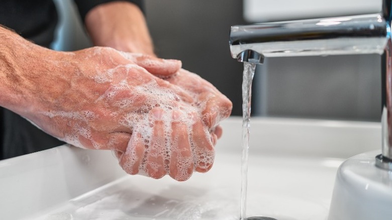 man washing hands
