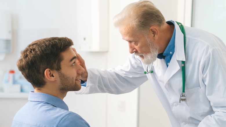 Doctor examining patient's eye